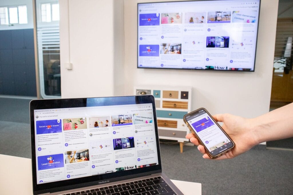 A laptop displaying the same content as a wall-mounted TV in a modern room, illustrating screen mirroring and local file casting to a TV.