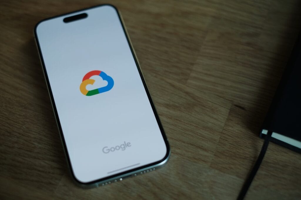 Google Cloud logo on smartphone screen representing cloud storage file sharing and video links