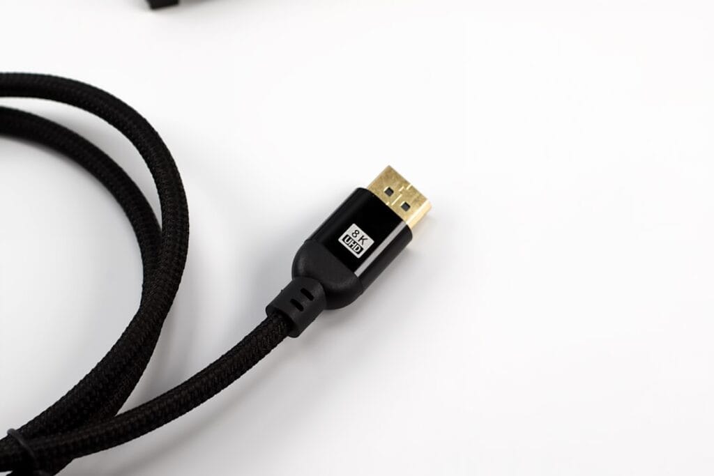 Close-up of an HDMI cable connector, the reliable wired fallback for connecting a laptop to a TV with zero latency.