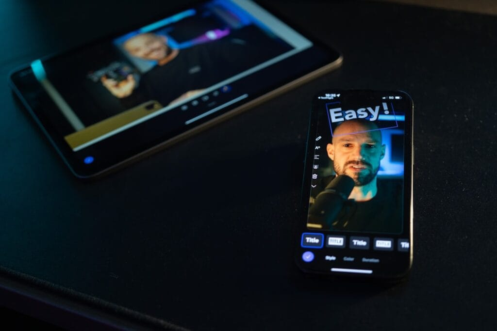8 Free iPhone Video Editing Apps: No Watermark Test iPhone displaying a mobile video editing app with a talking head clip on screen, alongside a tablet showing the same project